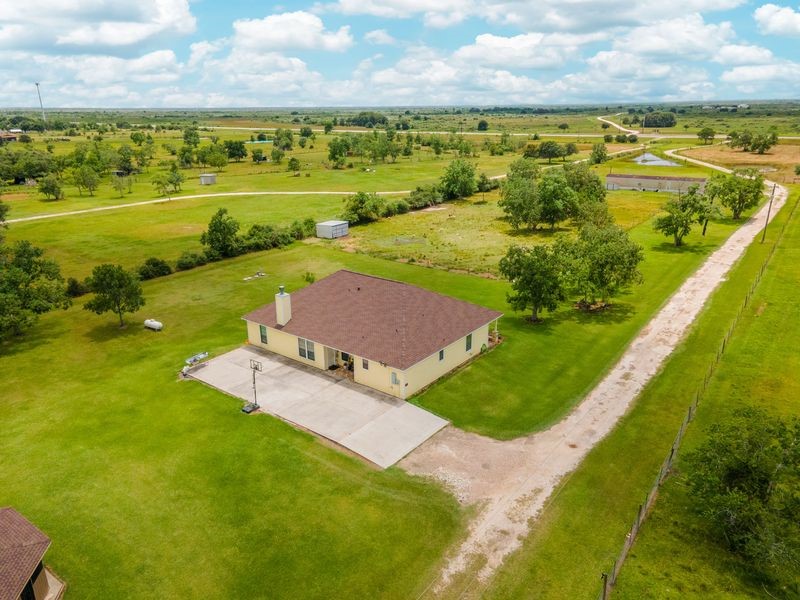 24910 Farm To Market 2004 Angleton, TX 77515 - Photo 37 of 50 a view of a lake with a yard