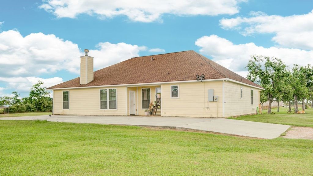 24910 Farm To Market 2004 Angleton, TX 77515 - Photo 40 of 50 a view of a house with a yard