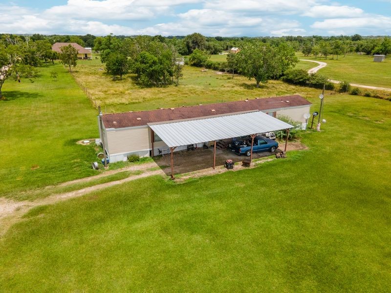 24910 Farm To Market 2004 Angleton, TX 77515 - Photo 42 of 50 a view of a lake with a mountain