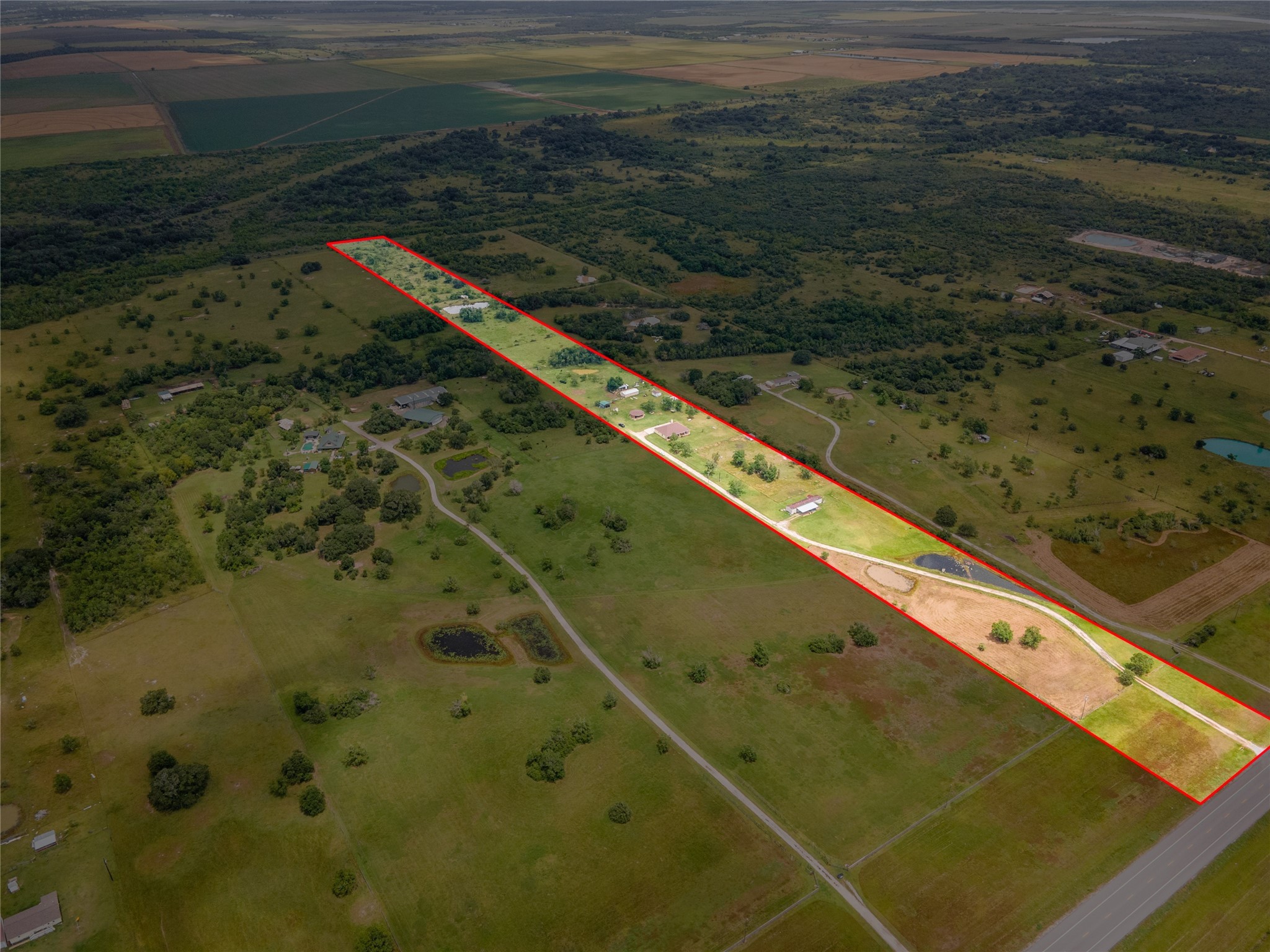24910 Farm To Market 2004 Angleton, TX 77515 - Photo 48 of 50 a blue swimming pool is sitting in middle of a lake
