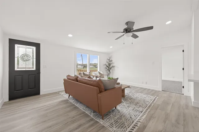 a living room with furniture and a window