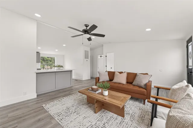 a living room with furniture and a rug