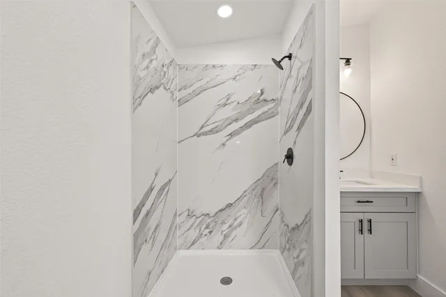 a bathroom with a sink and a mirror