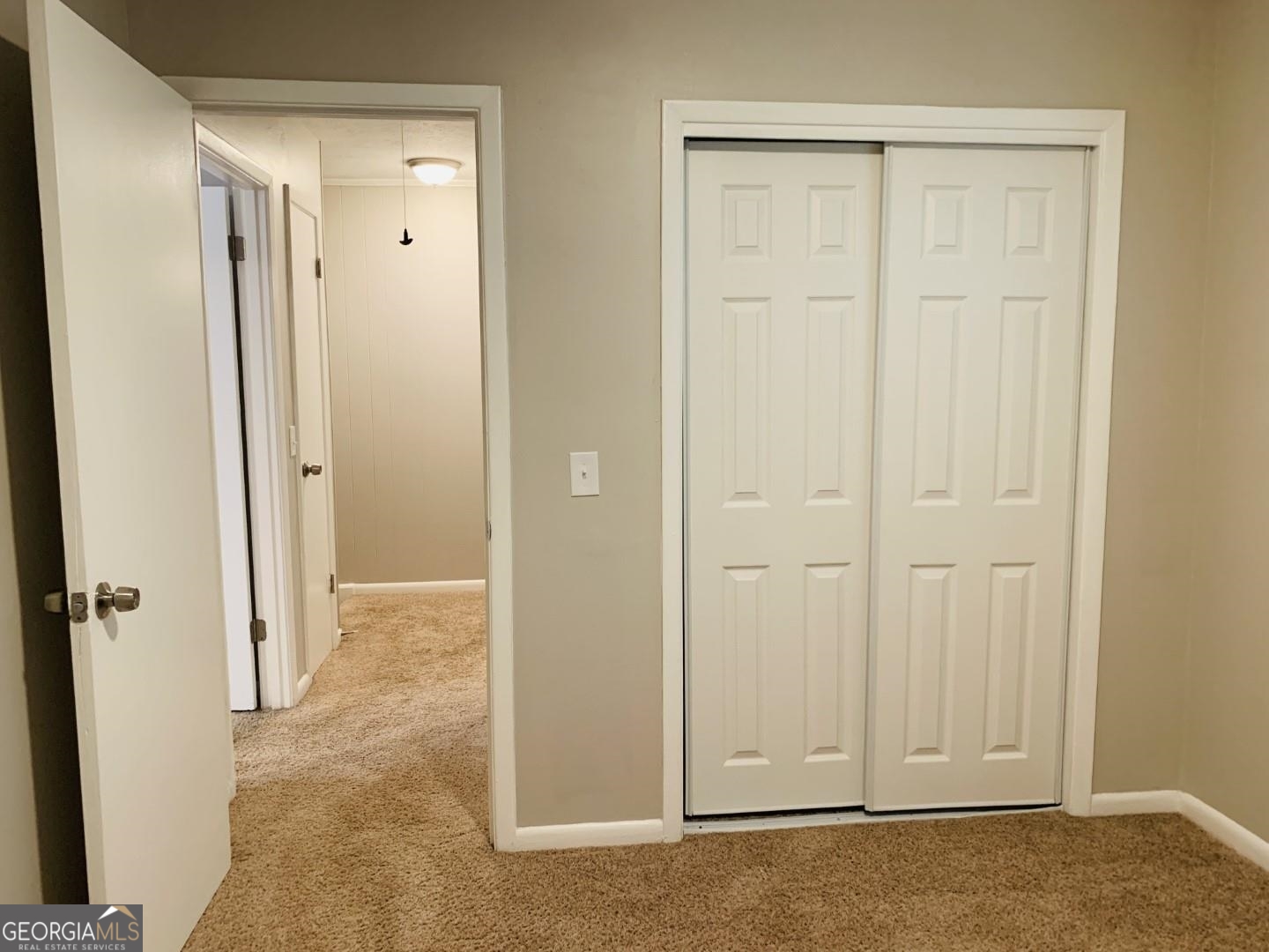 1069 Laurel Lane Northwest, Unit B Conyers, GA 30012 - Photo 16 of 28 an empty room with wooden door
