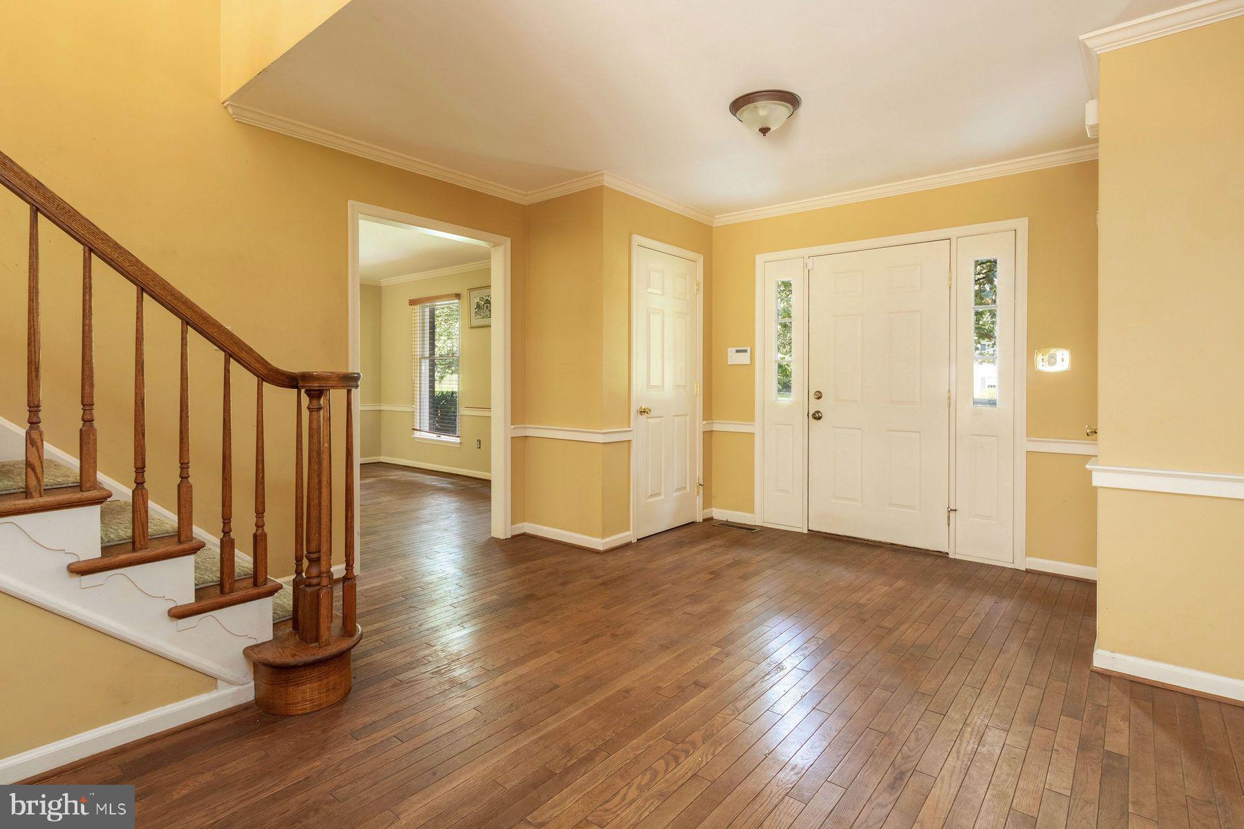 4887 Danielle Drive Doylestown, PA 18902 - Photo 11 of 35 a view of a hallway with wooden floor