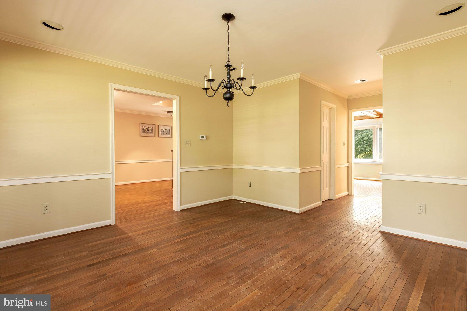 4887 Danielle Drive Doylestown, PA 18902 - Photo 14 of 35 an empty room with wooden floor ceiling fan and windows