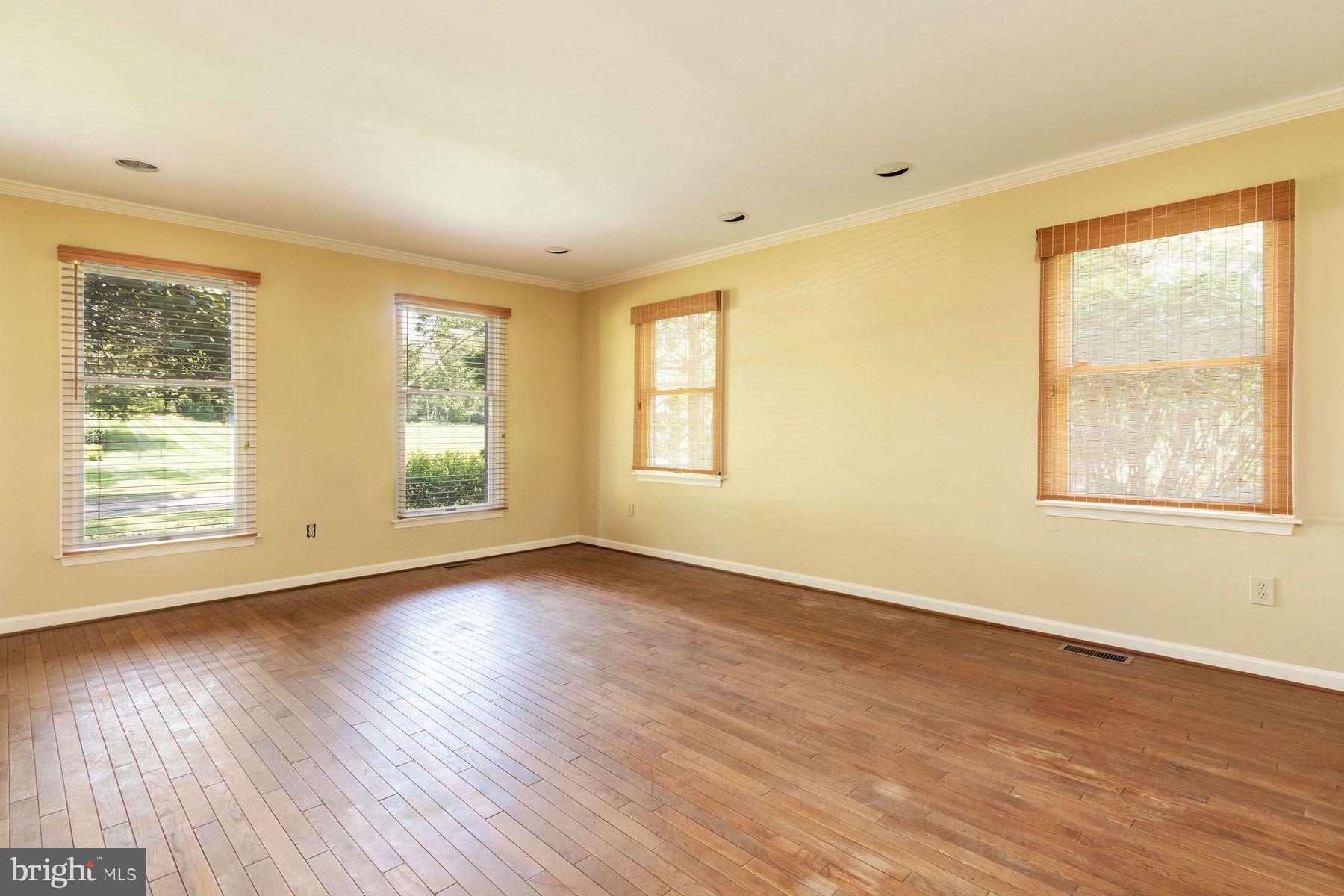 4887 Danielle Drive Doylestown, PA 18902 - Photo 15 of 35 a view of an empty room with wooden floor and a window