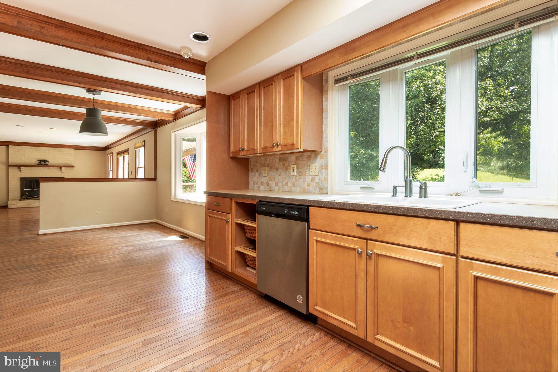 4887 Danielle Drive Doylestown, PA 18902 - Photo 23 of 35 a kitchen with stainless steel appliances granite countertop a stove a sink and a refrigerator