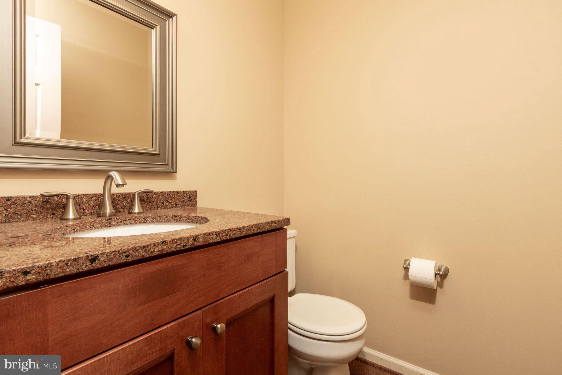 4887 Danielle Drive Doylestown, PA 18902 - Photo 25 of 35 a bathroom with a granite countertop sink and a toilet