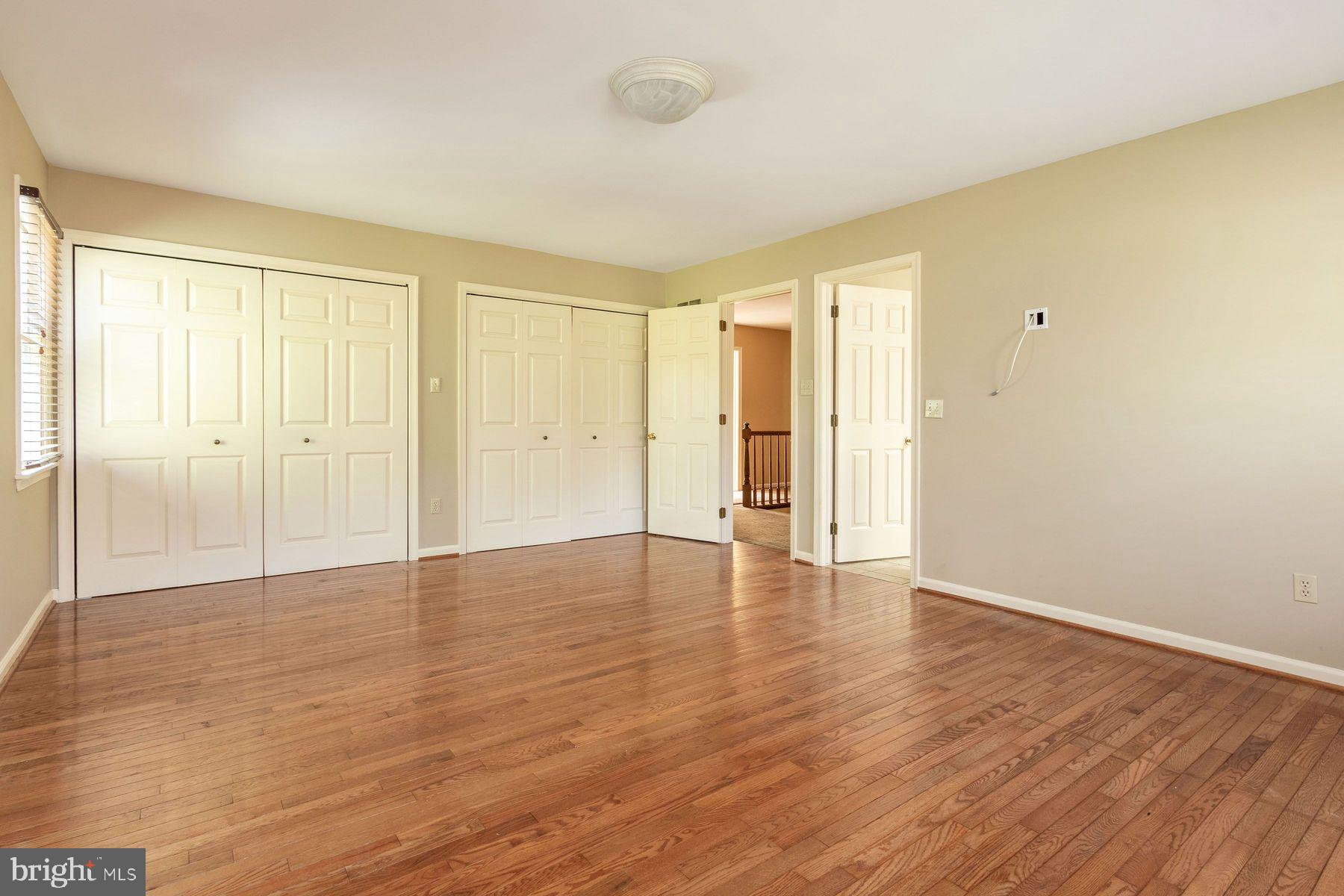 4887 Danielle Drive Doylestown, PA 18902 - Photo 27 of 35 a view of an empty room with wooden floor