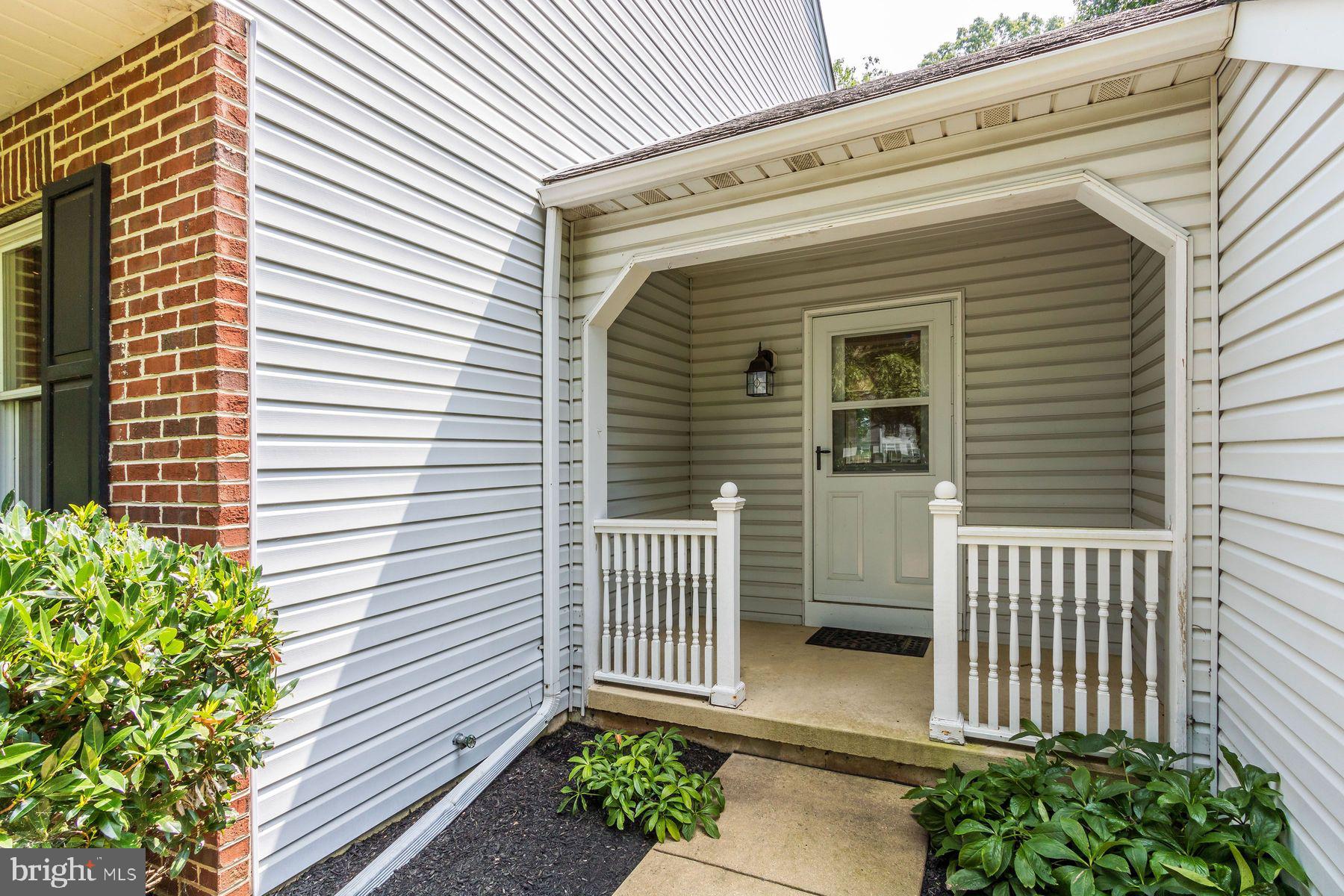 4887 Danielle Drive Doylestown, PA 18902 - Photo 34 of 35 a view of a house with a small yard and wooden floor and fence