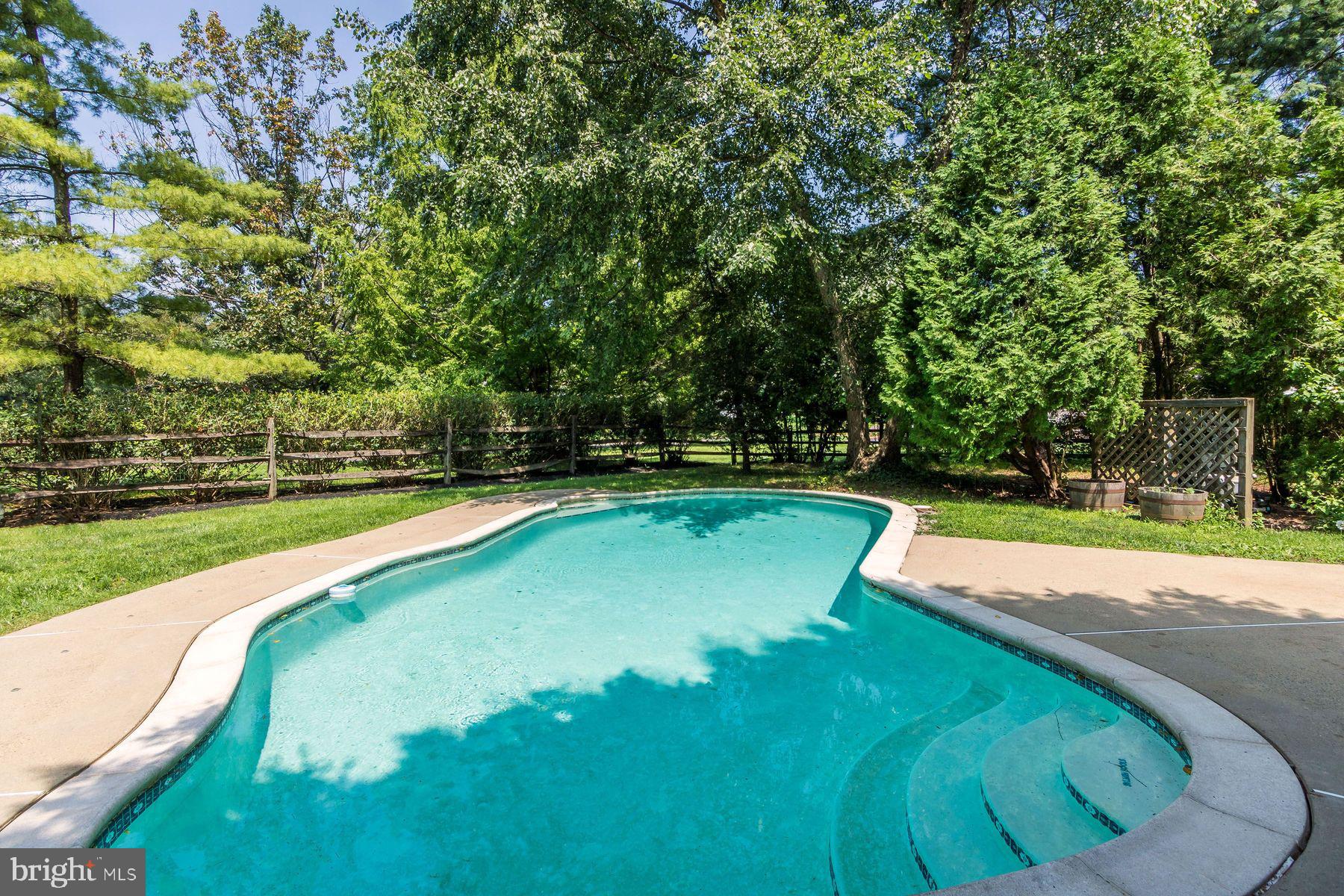 4887 Danielle Drive Doylestown, PA 18902 - Photo 4 of 35 a view of a swimming pool with a yard