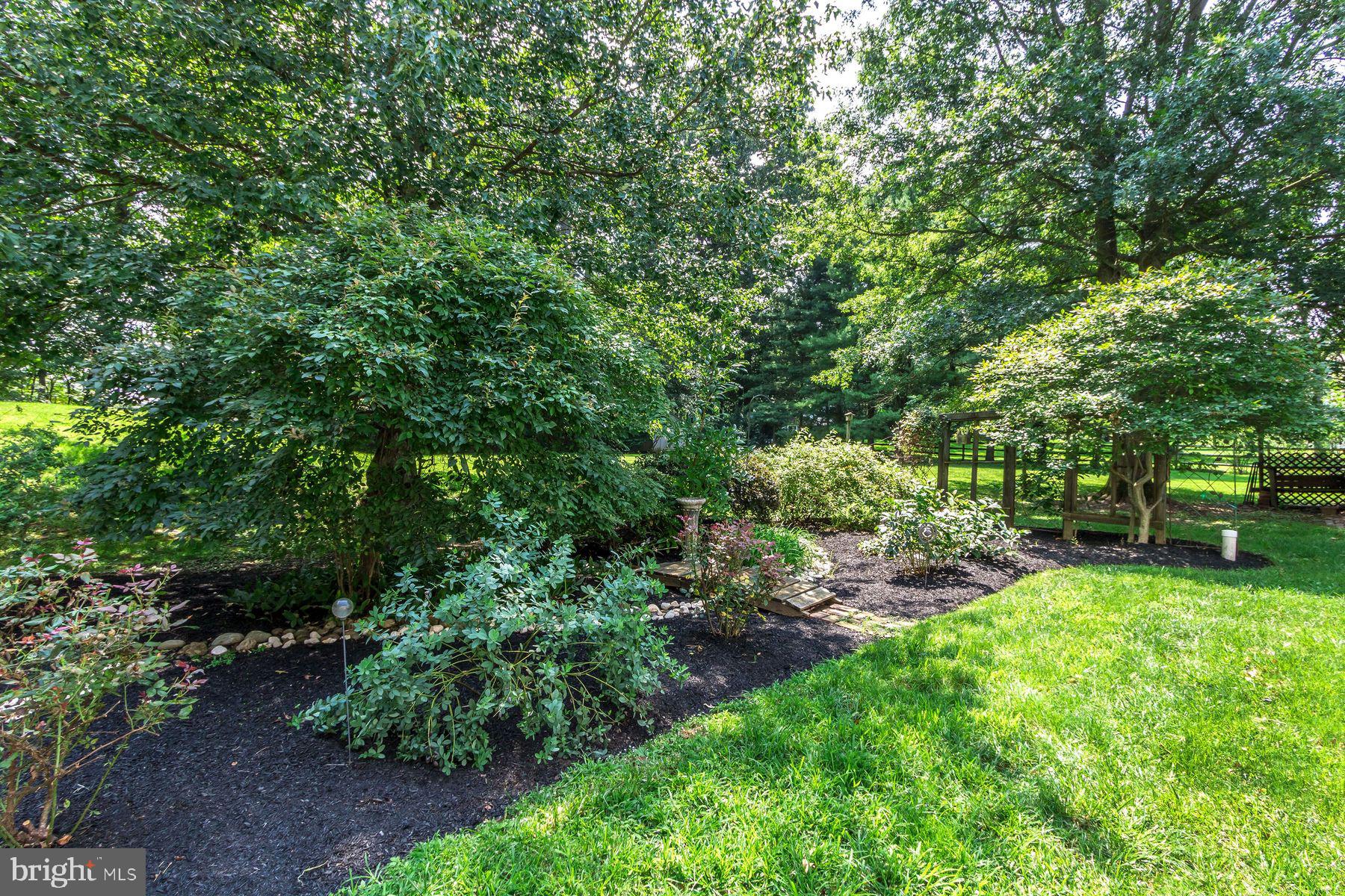 4887 Danielle Drive Doylestown, PA 18902 - Photo 7 of 35 a view of a backyard with a garden