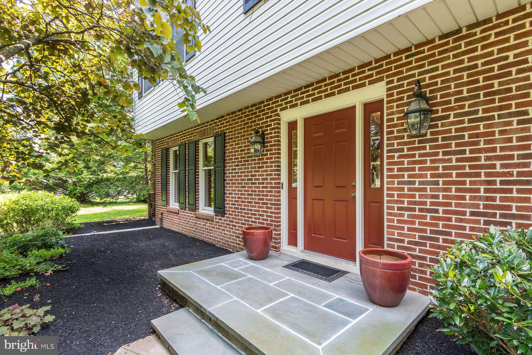 4887 Danielle Drive Doylestown, PA 18902 - Photo 10 of 35 a view of a backyard with chair and potted plants