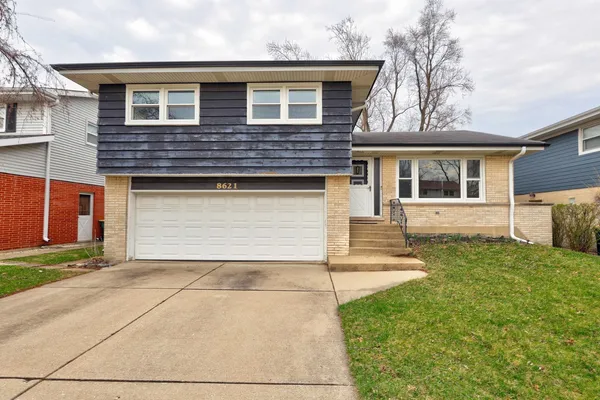 front view of a house with a yard
