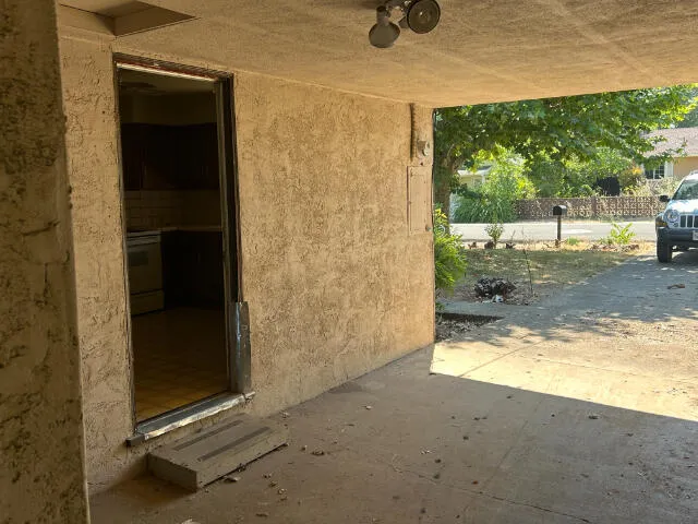a view of backyard with tub