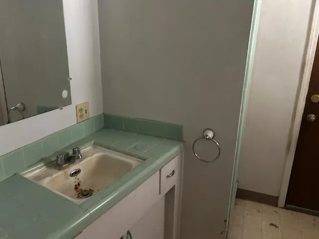 a bathroom with a sink and vanity