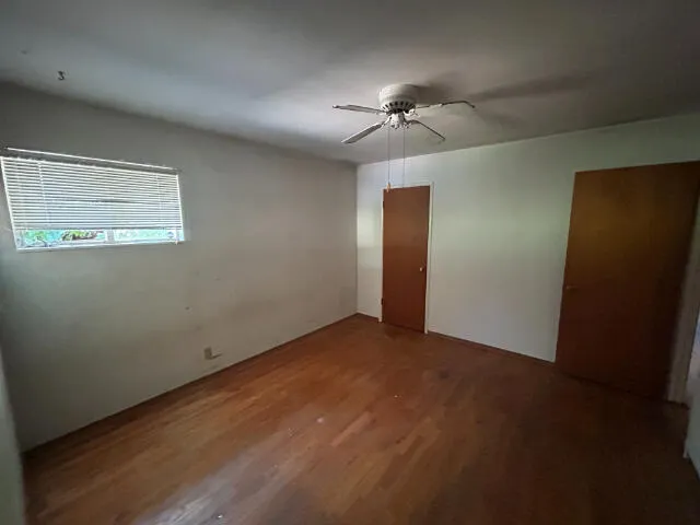 a view of an empty room with a fan