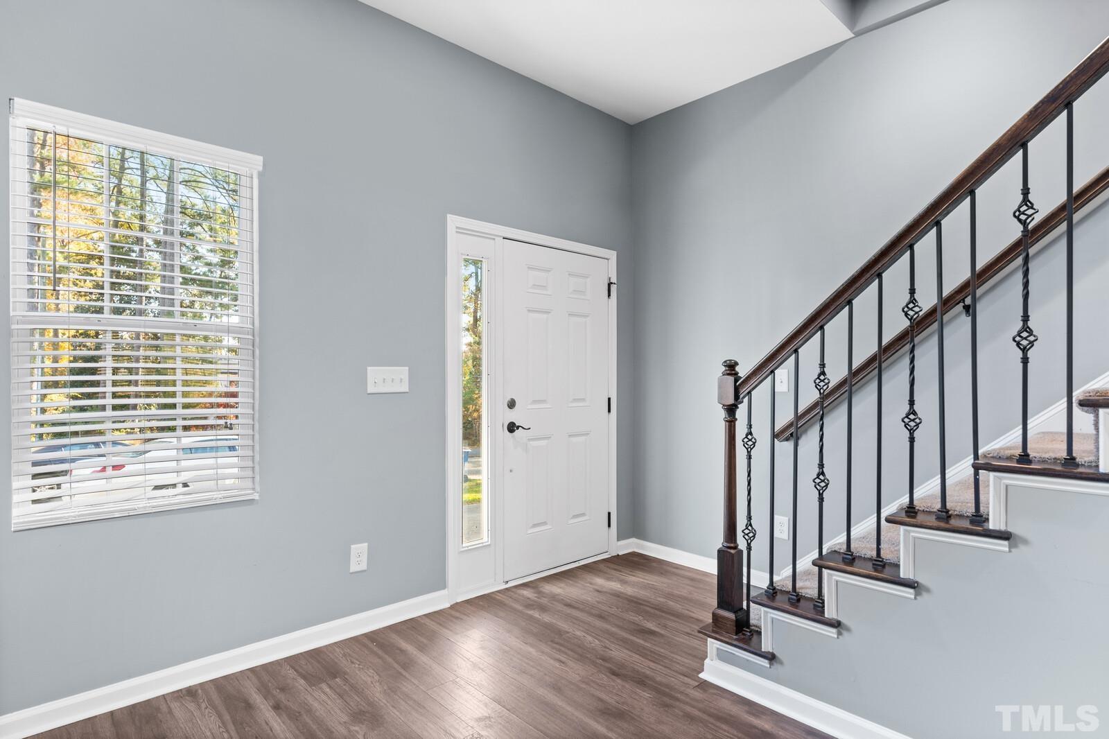 129 Pineland Circle, Unit 100 Raleigh, NC 27606 - Photo 19 of 29 a view of an entryway with wooden floor
