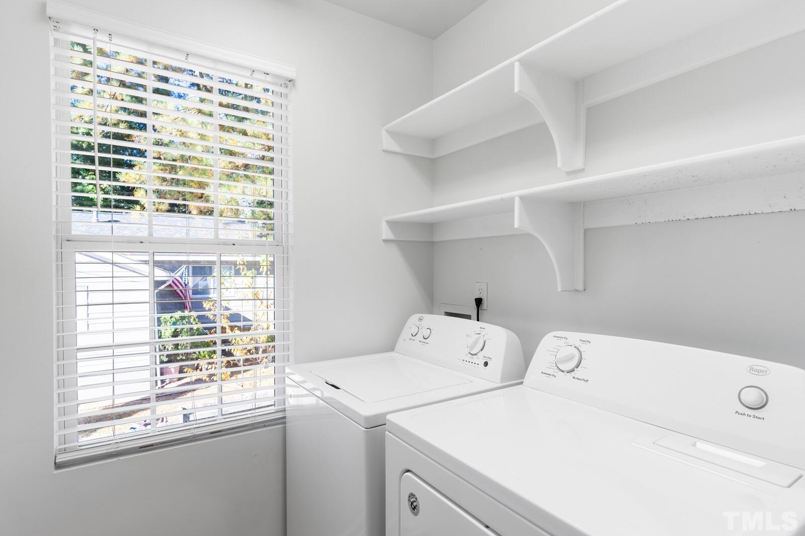 129 Pineland Circle, Unit 100 Raleigh, NC 27606 - Photo 26 of 29 a utility room with dryer and washer