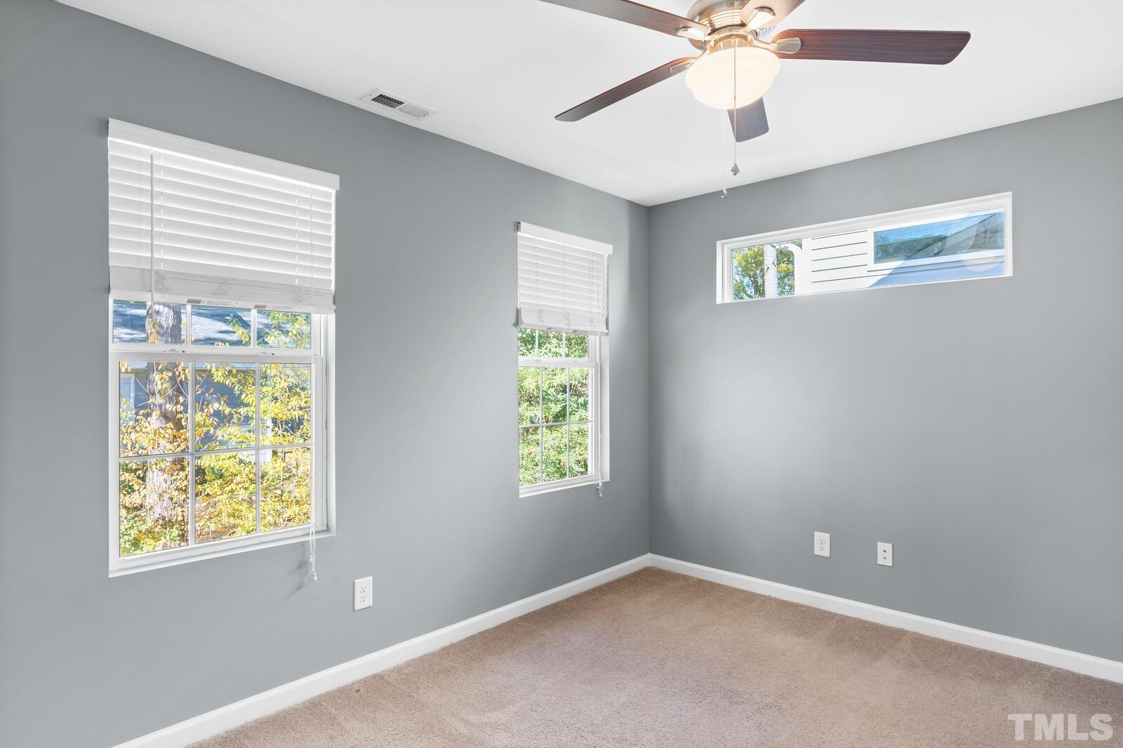 129 Pineland Circle, Unit 100 Raleigh, NC 27606 - Photo 28 of 29 a view of an empty room with a window