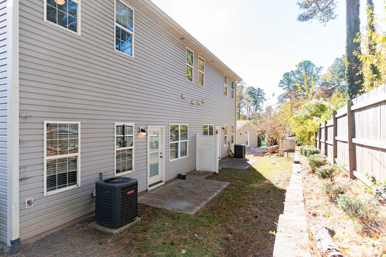 129 Pineland Circle, Unit 100 Raleigh, NC 27606 - Photo 29 of 29 a view of a house with backyard and sitting area