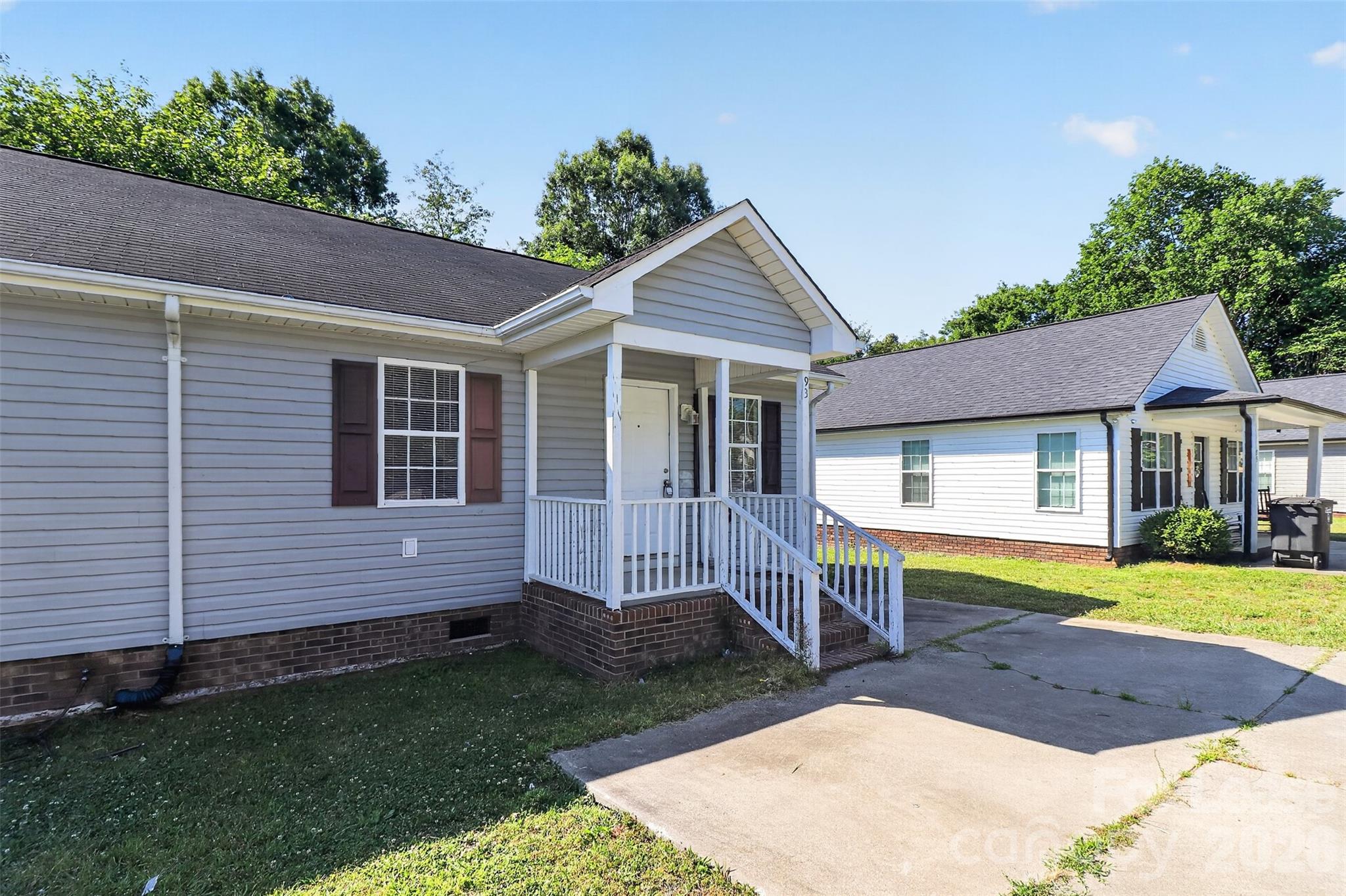 91-93 Sunderland Road Southwest, Unit 93 Concord, NC 28027 - Photo 3 of 30 a view of a house with a yard and sitting area