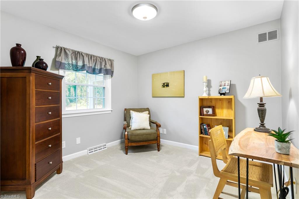 1803 Red Forest Road Greensboro, NC 27410 - Photo 21 of 35 This main level room perfect for a home office or nursery.
