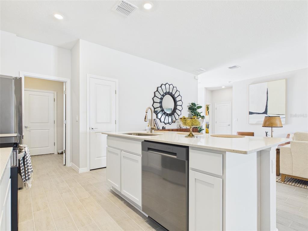 3498 Southwest 130th Ln Road Ocala, FL 34473 - Photo 13 of 31 a kitchen with a sink and cabinets