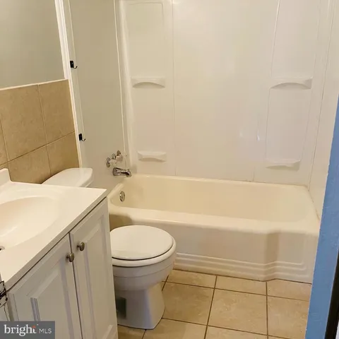 a bathroom with a sink a toilet and a bathtub