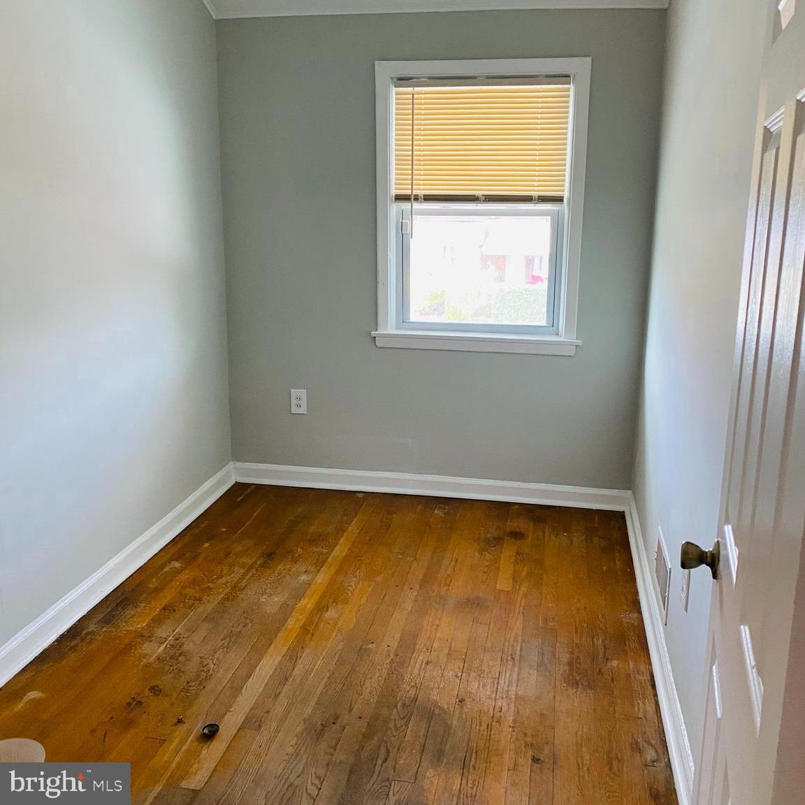 2073 Jasmine Road Dundalk, MD 21222 - Photo 10 of 12 a view of a room with wooden floor and window