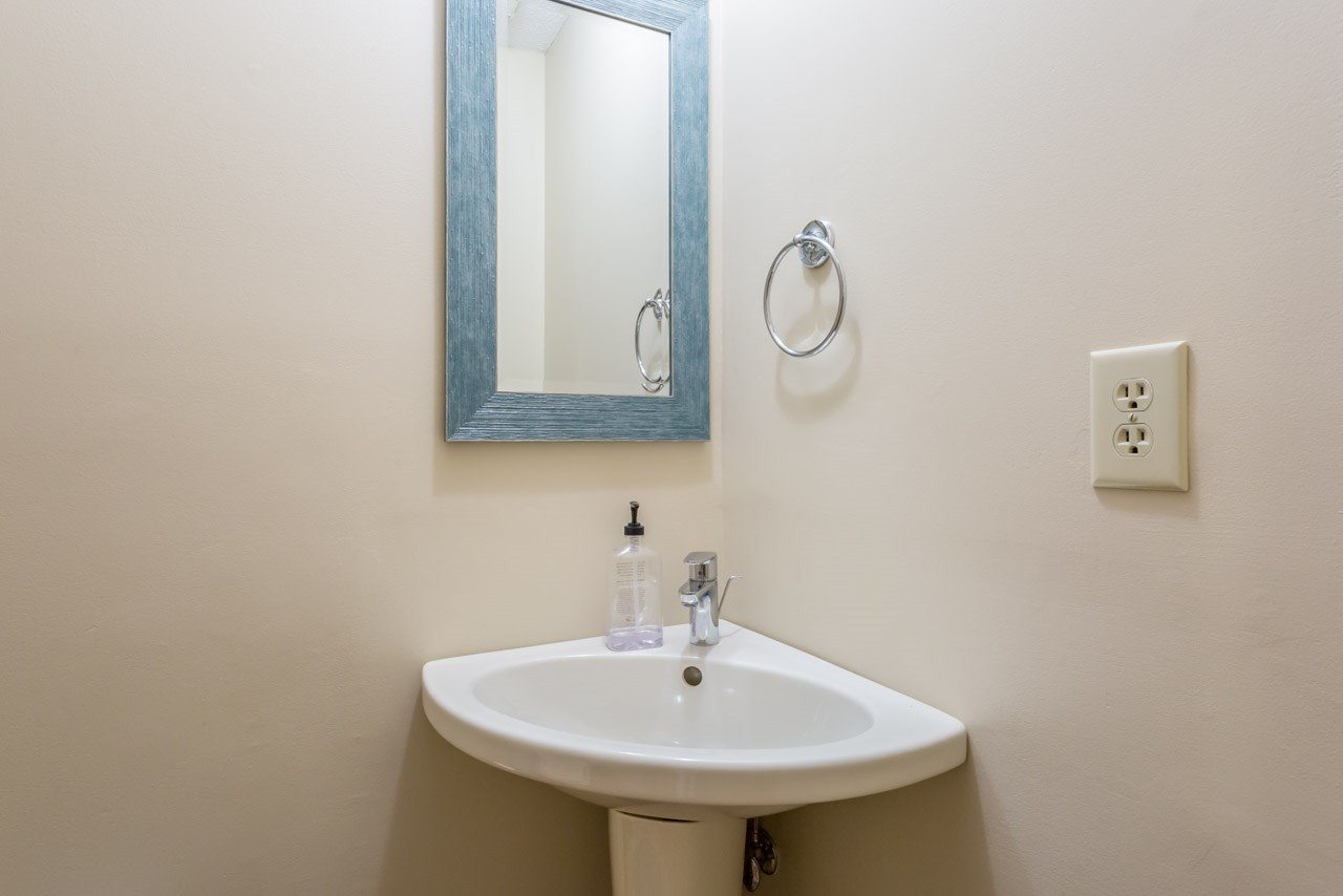 5200 Country Trail Raleigh, NC 27613 - Photo 12 of 25 Downstairs powder room features a efficient use of space. Bathroom