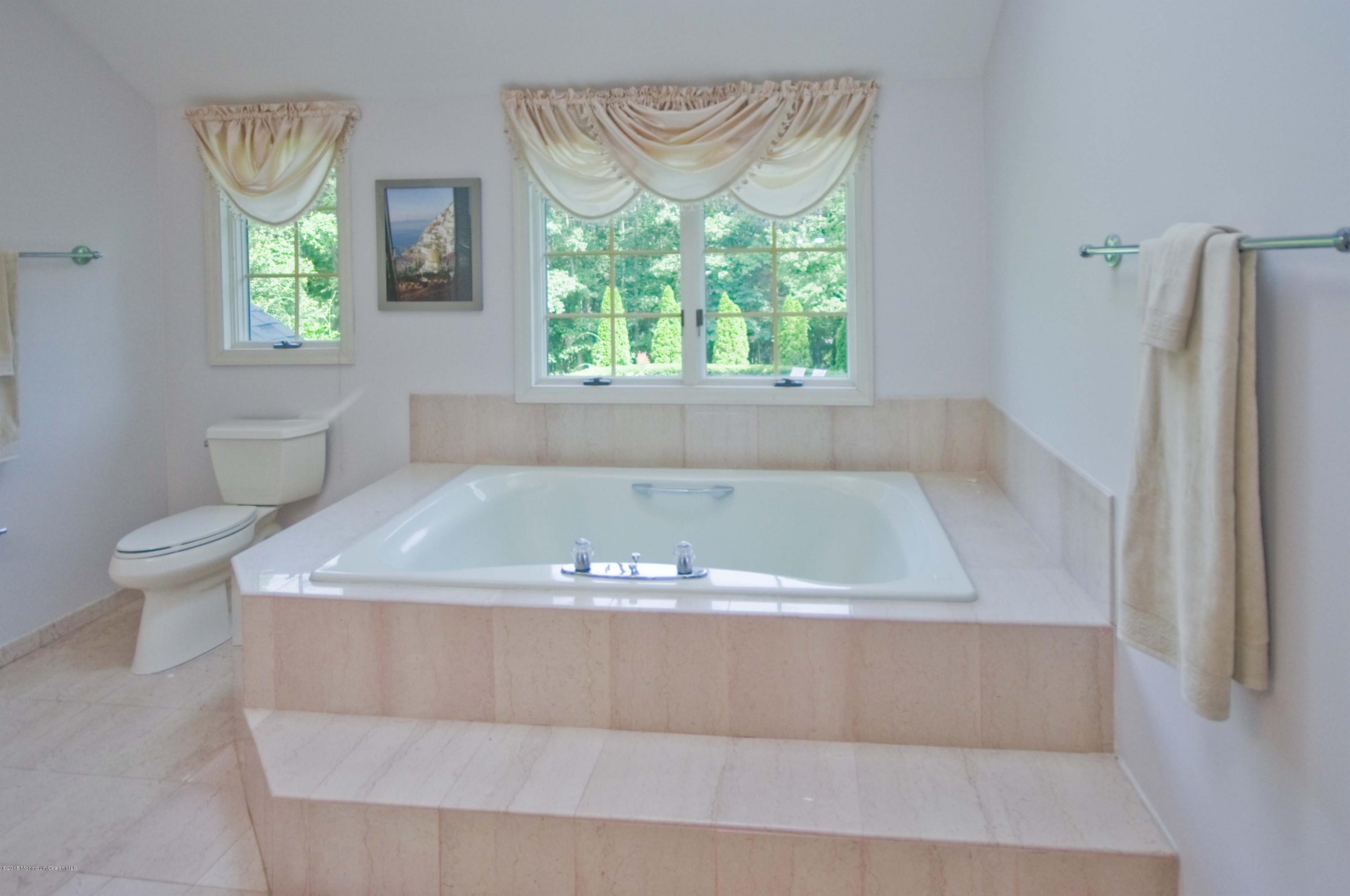 48 Crow Hill Road Freehold, NJ 07728 - Photo 15 of 29 a bathroom with a bathtub