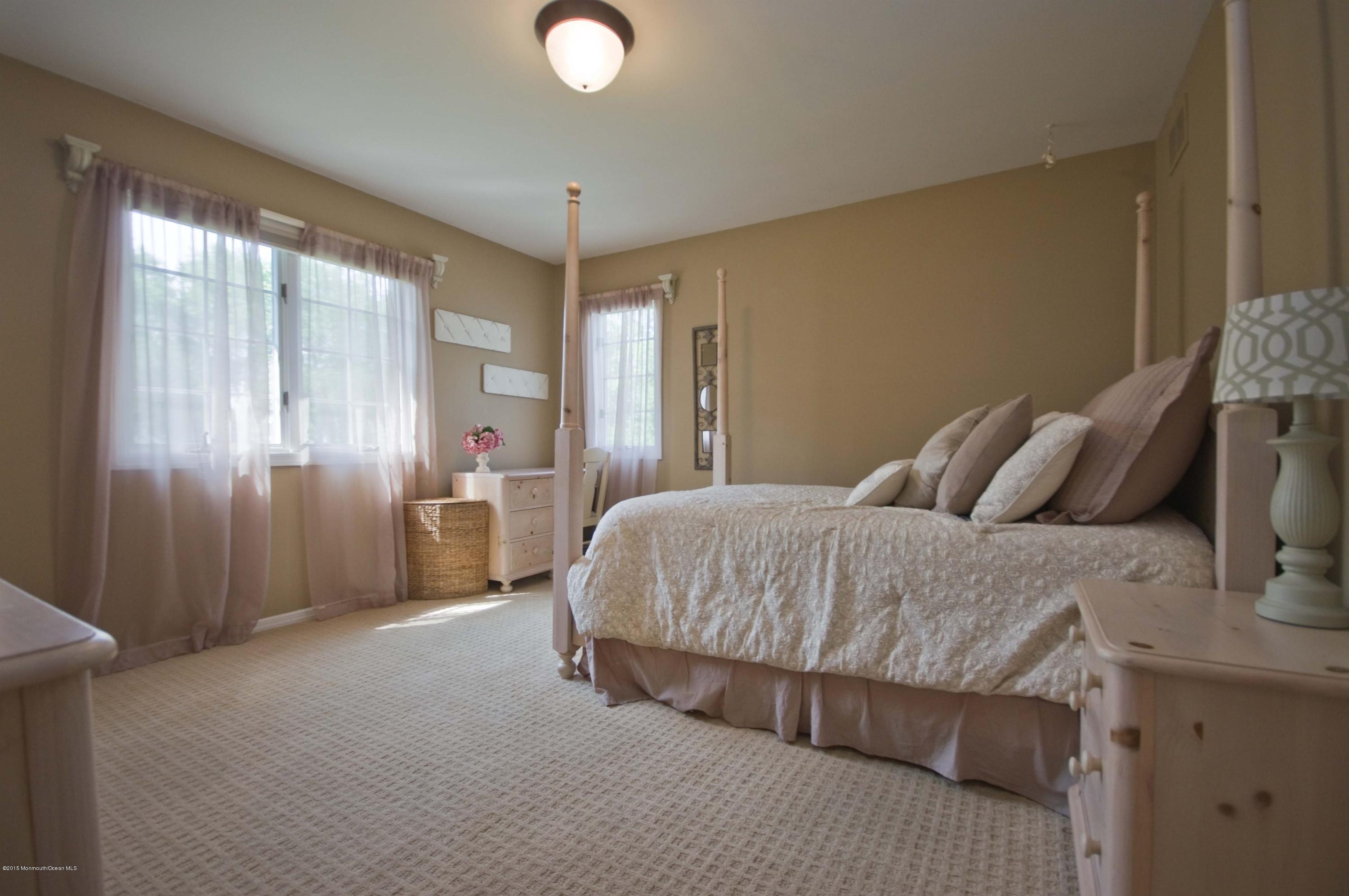 48 Crow Hill Road Freehold, NJ 07728 - Photo 20 of 29 a spacious bedroom with a bed and a window
