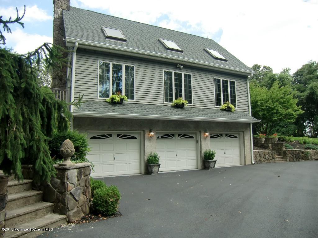 48 Crow Hill Road Freehold, NJ 07728 - Photo 2 of 29 a front view of a house with garage