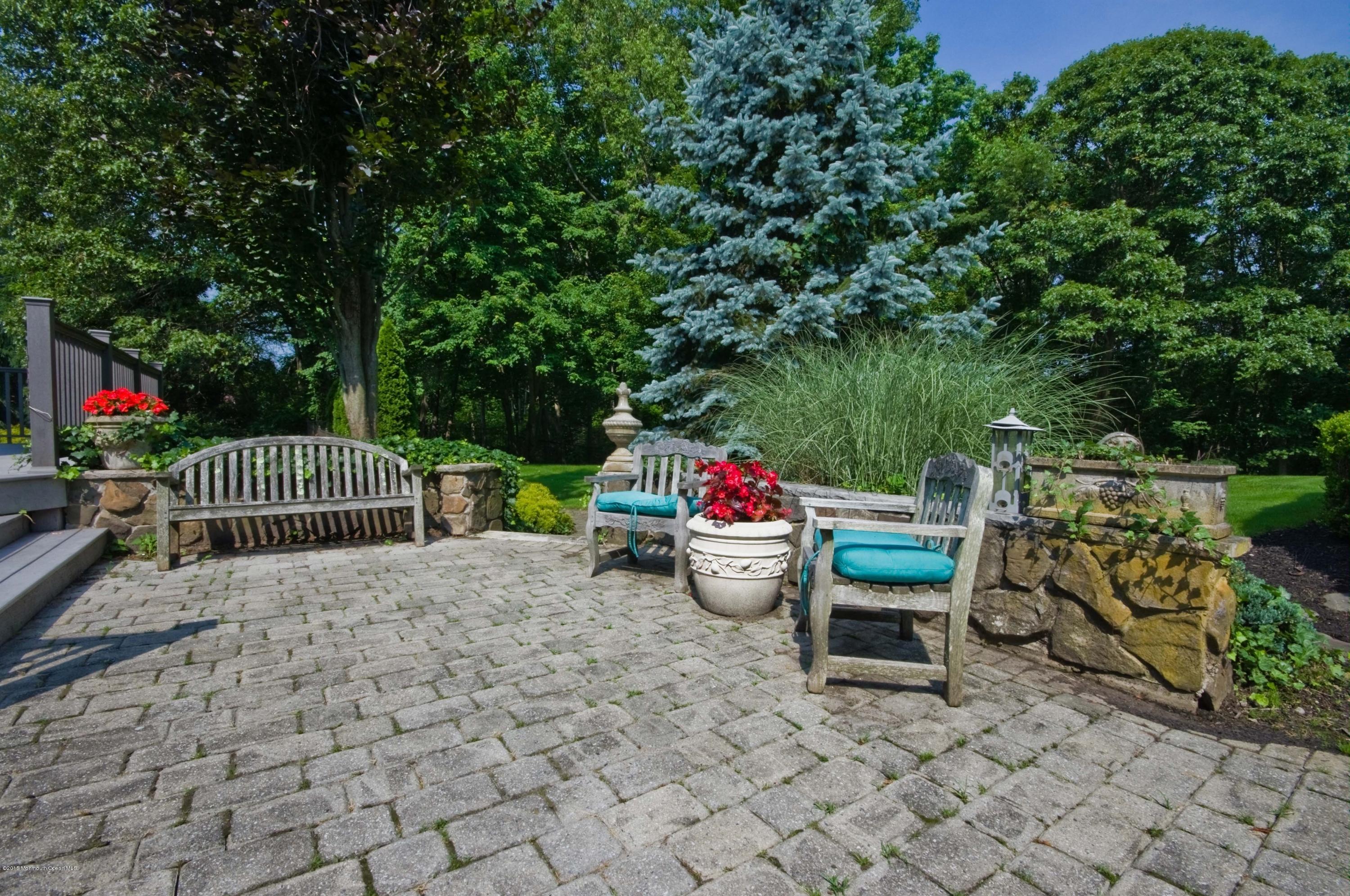 48 Crow Hill Road Freehold, NJ 07728 - Photo 25 of 29 a view of backyard with furniture and trees