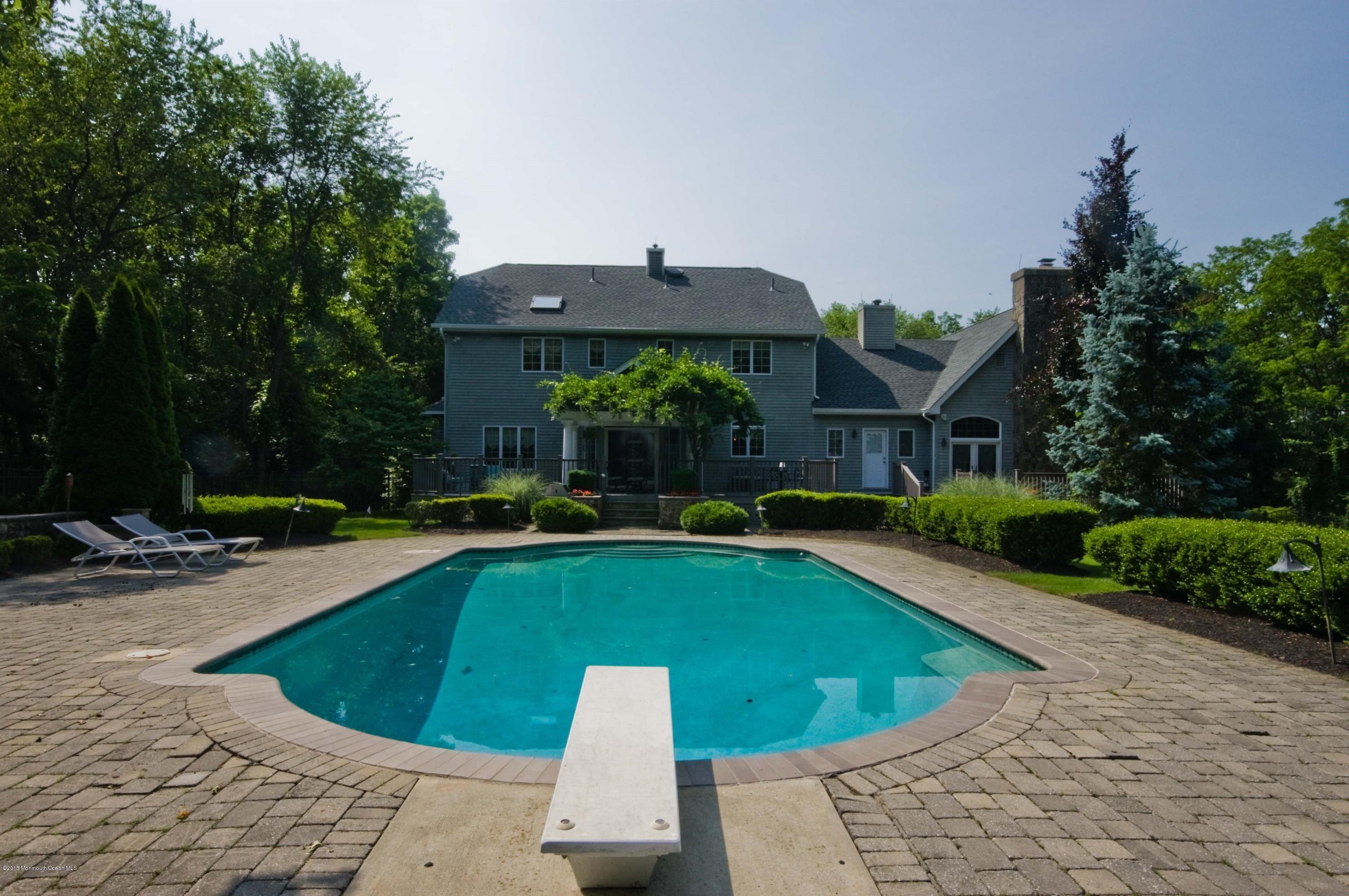 48 Crow Hill Road Freehold, NJ 07728 - Photo 28 of 29 a view of a house with swimming pool and sitting area