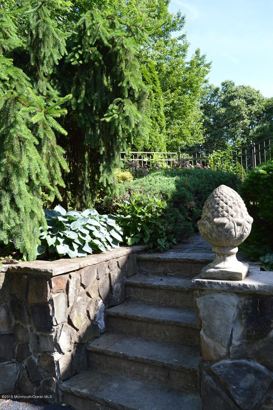 48 Crow Hill Road Freehold, NJ 07728 - Photo 3 of 29 a view of a fountain in back yard of the house