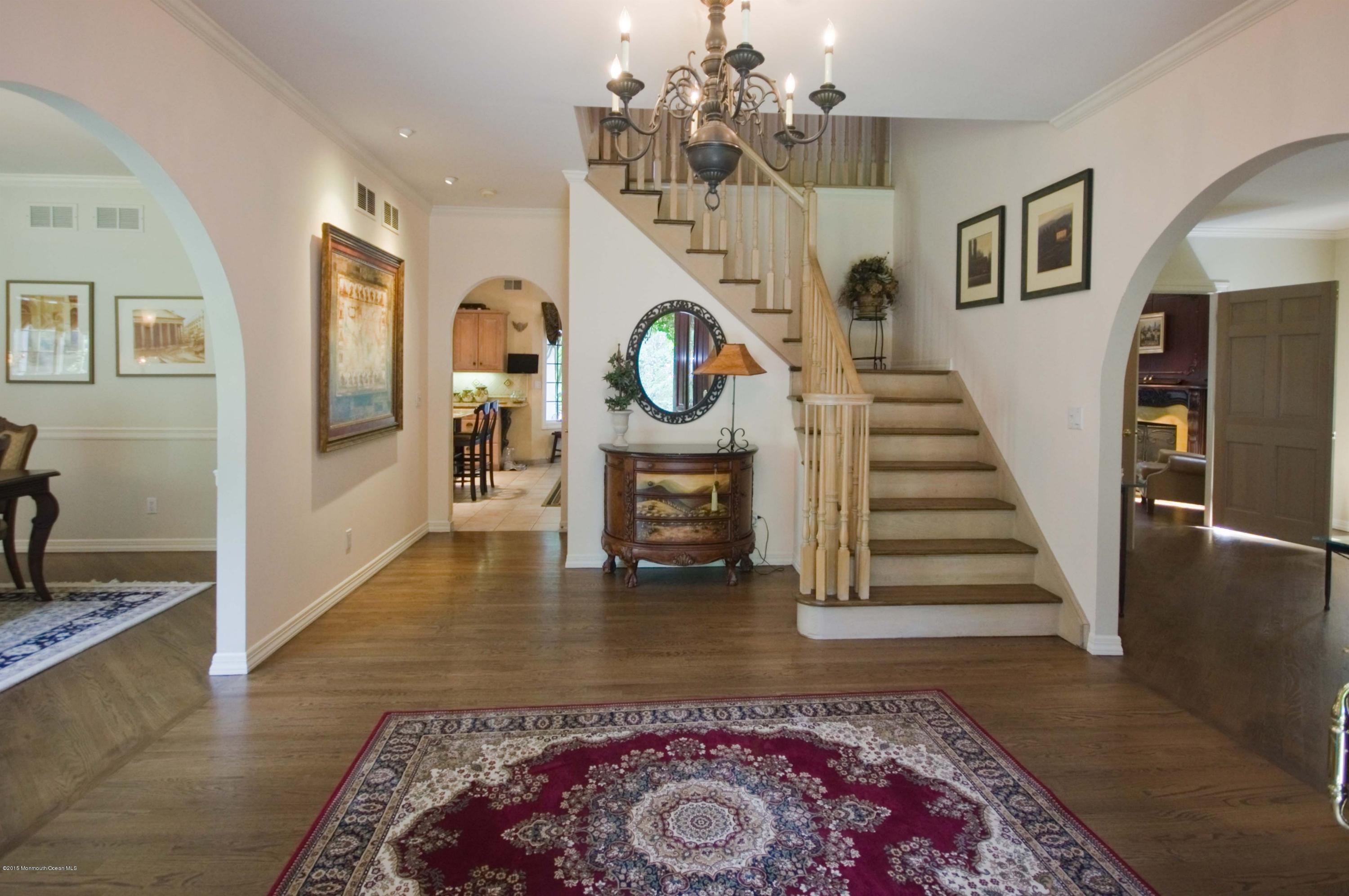 48 Crow Hill Road Freehold, NJ 07728 - Photo 4 of 29 a living room with wooden floor and a rug