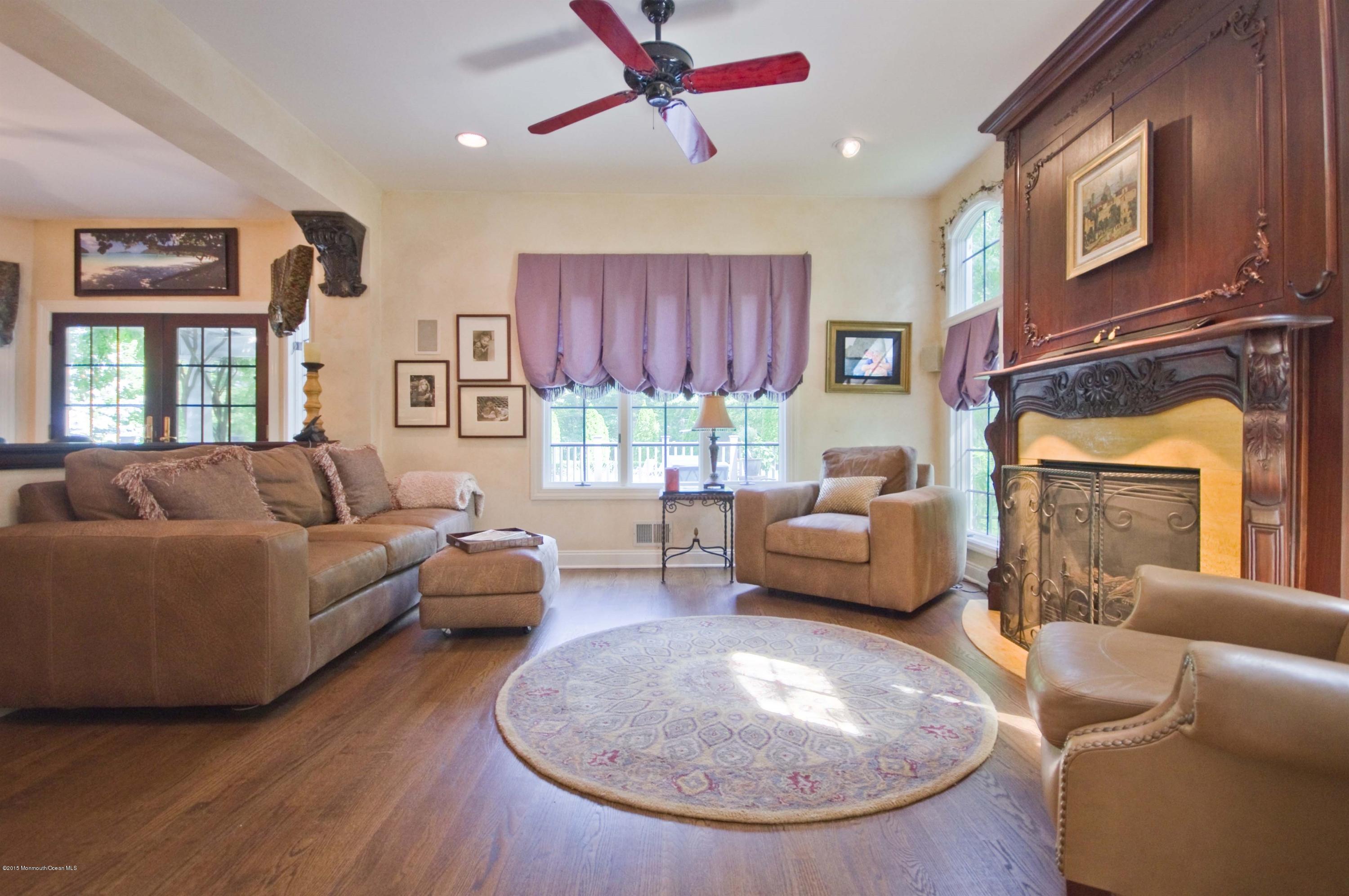 48 Crow Hill Road Freehold, NJ 07728 - Photo 7 of 29 a living room with furniture and a fireplace