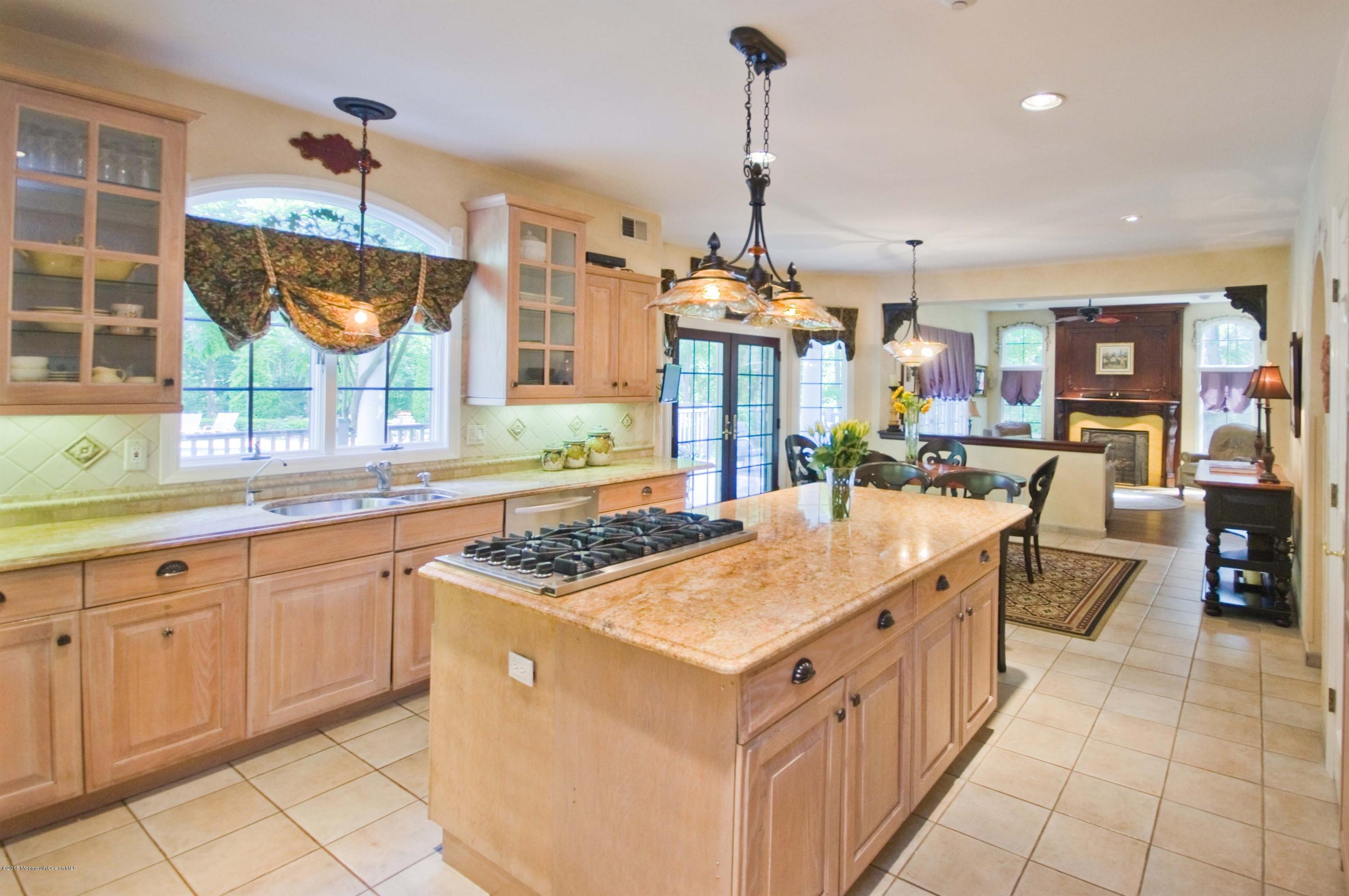 48 Crow Hill Road Freehold, NJ 07728 - Photo 8 of 29 a kitchen with stainless steel appliances granite countertop a stove and a sink