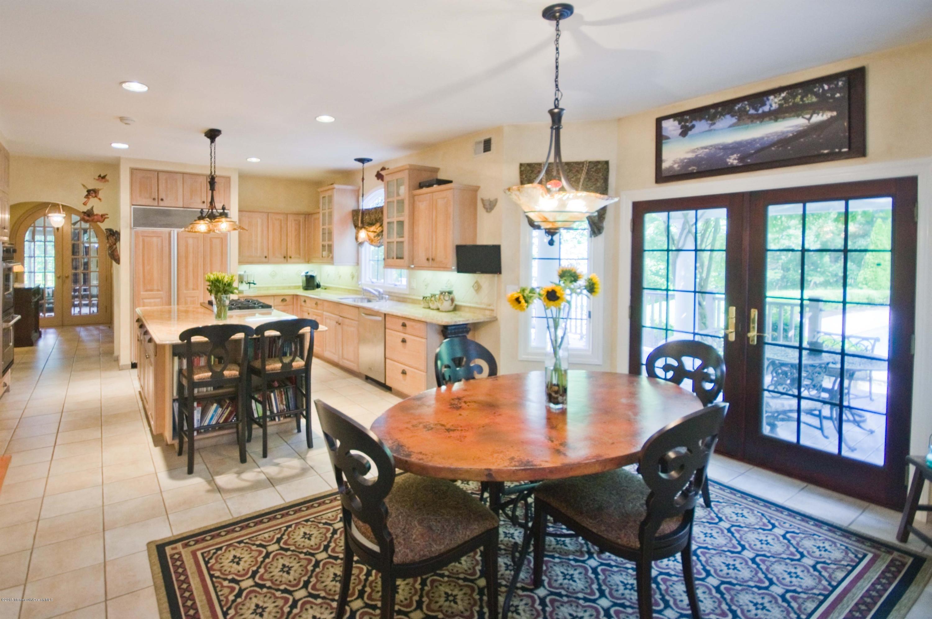 48 Crow Hill Road Freehold, NJ 07728 - Photo 9 of 29 a dining room with furniture a chandelier and wooden floor
