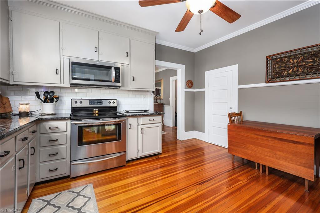 271 North Main Street Denton, NC 27239 - Photo 18 of 50 Kitchen with attached microwave and beauitful hardwood floors