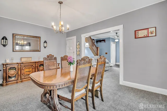 a dining room with furniture and window