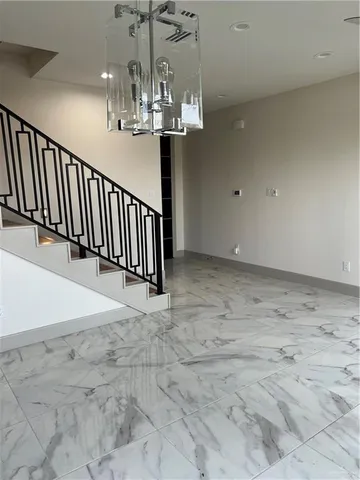 a view of room with wooden floor