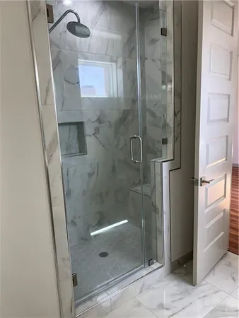 a view of lobby with a floor to ceiling window and an outdoor view