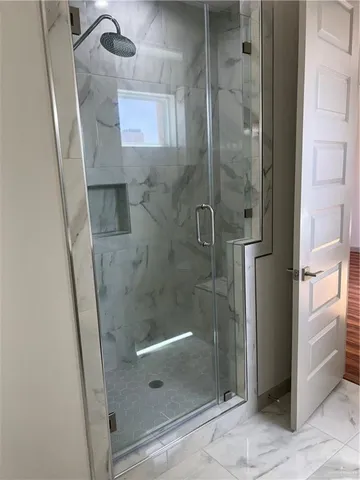 a view of lobby with a floor to ceiling window and an outdoor view