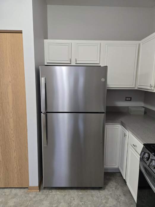 614 Littleton Trail Elgin, IL 60120 - Photo 11 of 29 a view of a refrigerator in kitchen with stainless steel appliances wooden cabinet