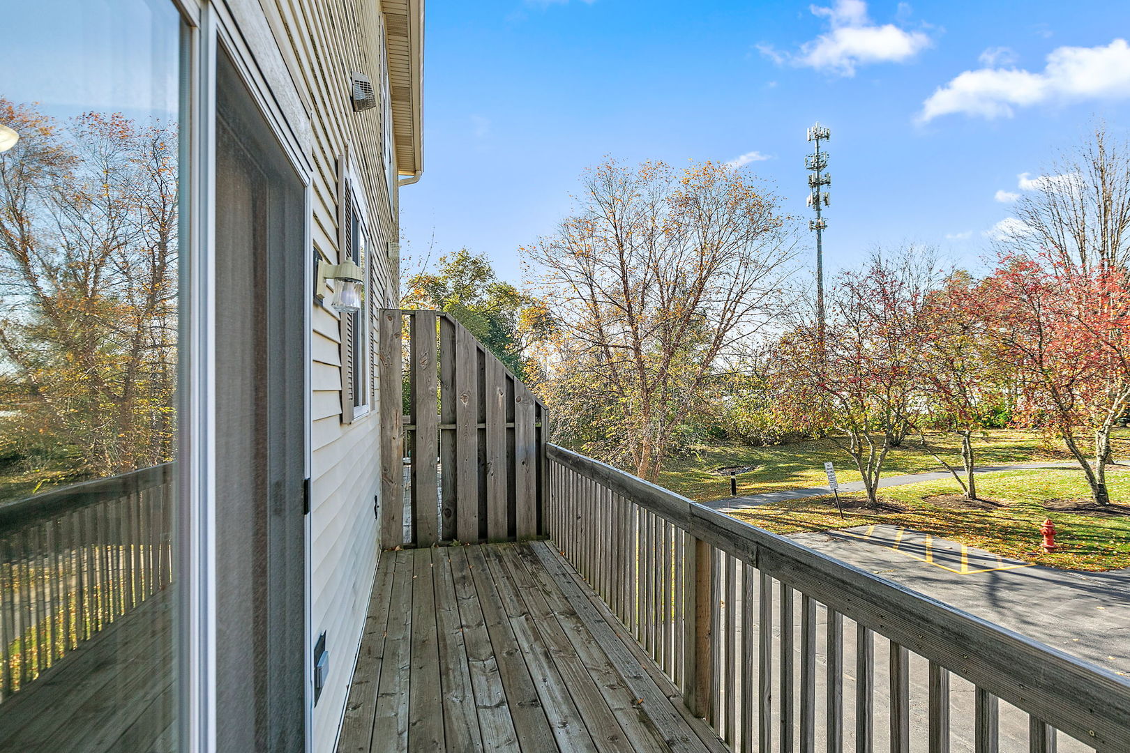 614 Littleton Trail Elgin, IL 60120 - Photo 16 of 29 a view of a wooden balcony and trees