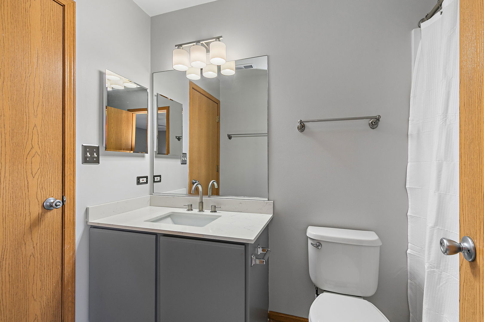 614 Littleton Trail Elgin, IL 60120 - Photo 21 of 29 a bathroom with a toilet sink and mirror